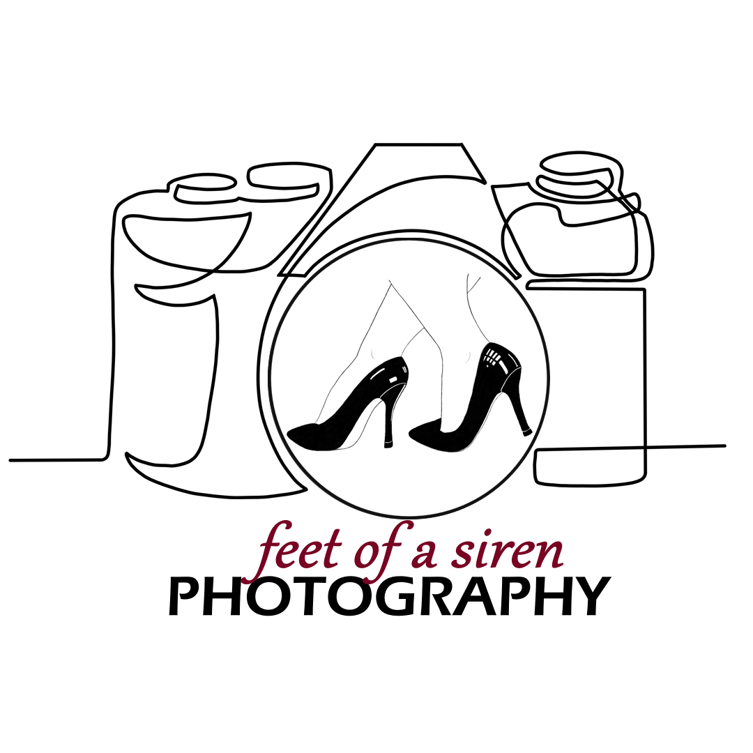 Feet of a Siren Photography Logo, a continuous line drawing of a camera facing the viewer, with the image of a drawing of feminine legs in black patent heels inside the lens area.