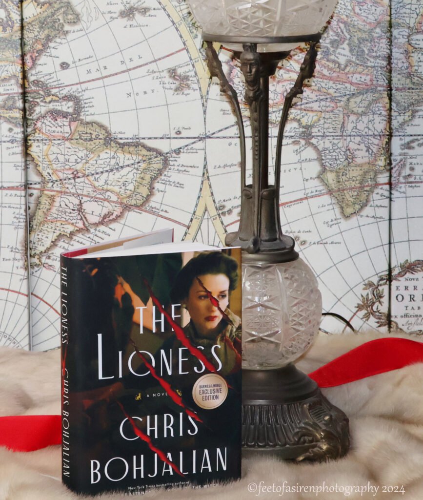 The Lioness book. Lamp, Map and red ribbon